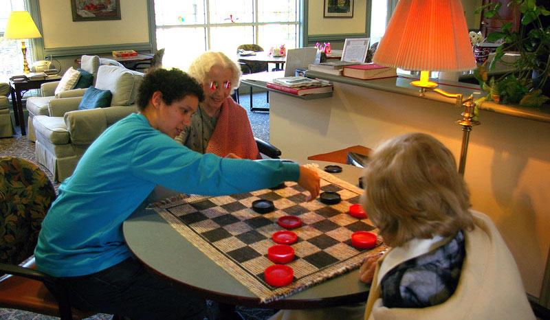 Enjoying a game of checkers at Lynn House.